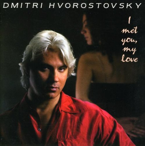 CD cover featuring a man in red shirt and a woman in the background.