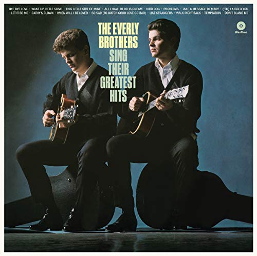 "Vinyl record cover featuring The Everly Brothers kneeling with guitars against a blue background."