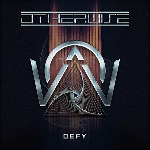 "Clear vinyl record with black album cover featuring silver 'Otherwise' logo and 'Defy' text."