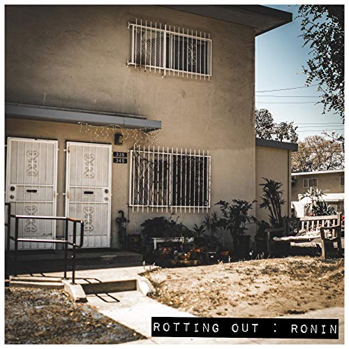 "Album cover with a beige building and a yard, titled 'Rotting Out: Ronin'."