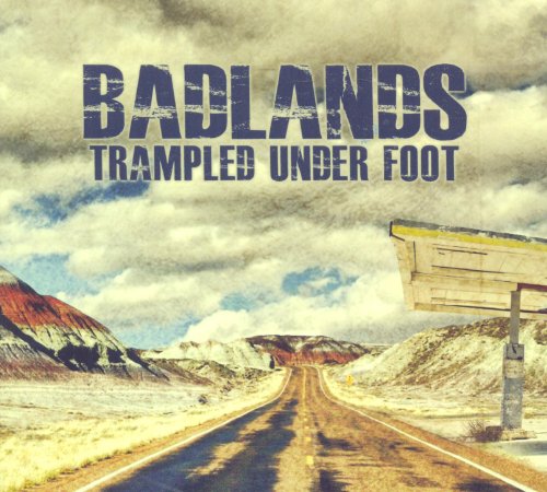 "Album cover with a desert road and cloudy sky, titled 'Badlands' by Trampled Under Foot."