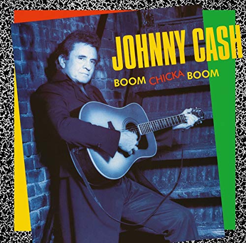 Vinyl record with cover featuring Johnny Cash holding a guitar against a brick wall.