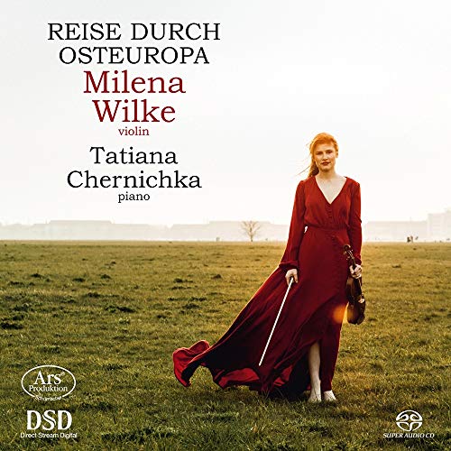 "CD cover featuring a woman in red dress holding a violin in a field."