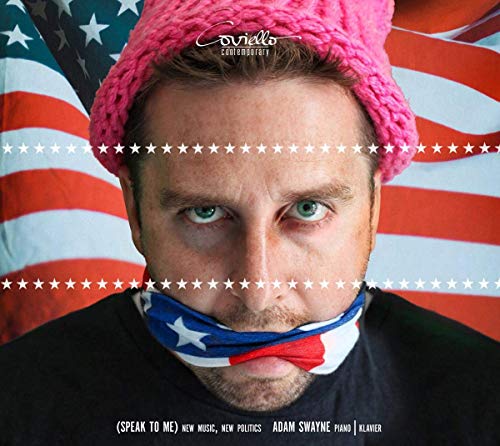 A man with a pink knit hat and American flag cloth over his mouth.