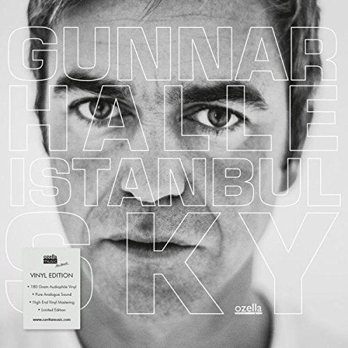 "Black and white vinyl album cover with a man's face and superimposed text."