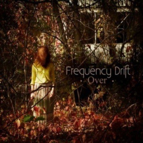 "Album cover featuring a woman in a yellow shirt standing in a dark forest."