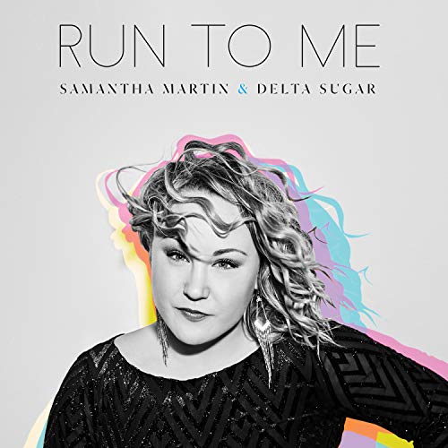 Album cover with a black-and-white woman's portrait and colorful abstract design behind her.