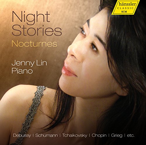 "Album cover featuring a woman with long dark hair and a silver shoulder strap."