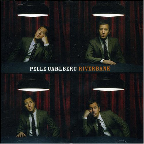 "CD cover with four images of a man in a suit under lamps."