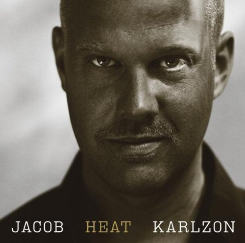 Black and white close-up of a man's face with text "Jacob Heat Karlzon" below.