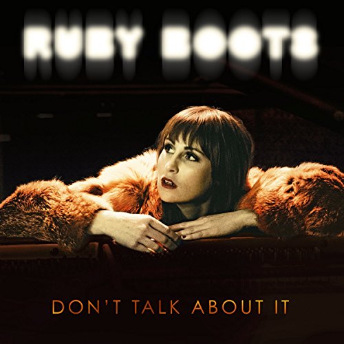 The image is a vinyl record cover featuring a woman in a fur coat. For accessibility purposes, a suitable alt text could be: "Woman in a fur coat leaning on a surface."