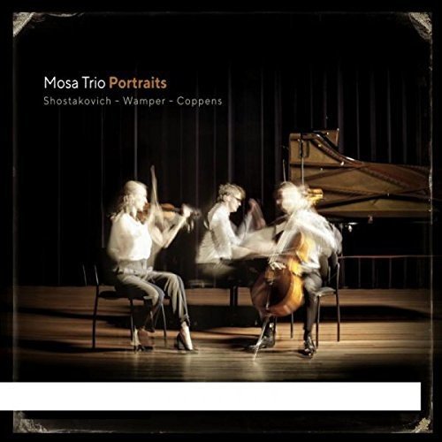"CD cover featuring a blurred image of three musicians playing instruments on a stage."