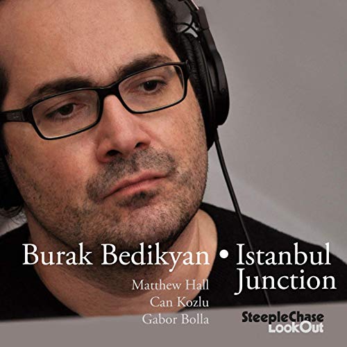 Man wearing headphones and glasses, with text overlay listing names and album title.