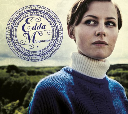 "Edda Magnason album cover featuring a woman in blue sweater against a green landscape."