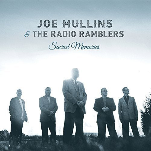 "CD cover with five men in suits standing outdoors, blue-toned image."