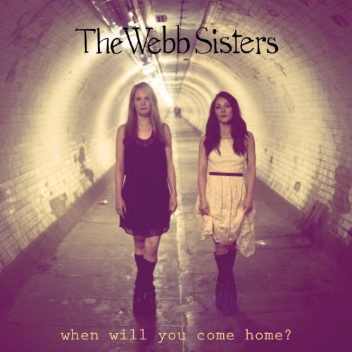 "Album cover featuring two women standing in a dimly lit tunnel."