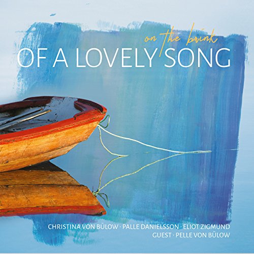 "CD cover featuring a wooden boat on blue water with white and yellow text."