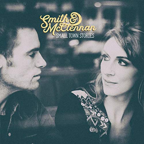 "Album cover with man and woman facing each other, blue-toned image, artist names at top."