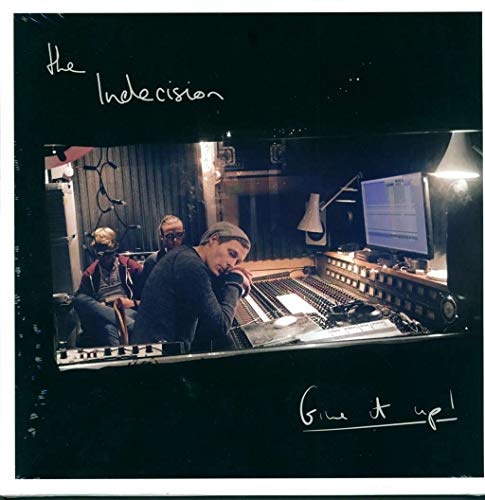 Vinyl album cover with a photo of three men in a recording studio.