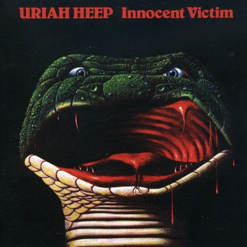 "Uriah Heep album cover with band members and 'Innocent Victim' title, dark background, green tint."