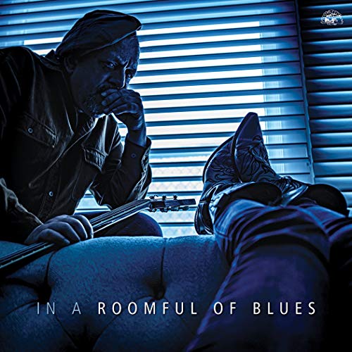 CD album cover with a man playing guitar beside a reclined person, blue-toned image.