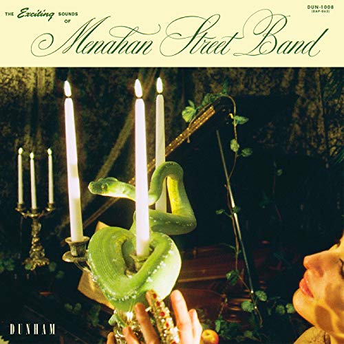 Album cover with a woman holding a candelabra, surrounded by dark, lush decor.