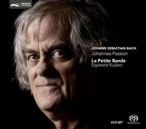CD cover featuring a close-up of a man's face against a dark background.