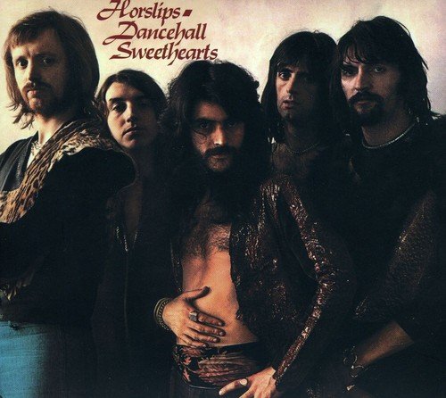 "Album cover featuring five men, with band name and album title in red text."