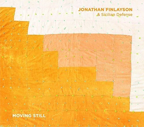 "Album cover with orange quilted pattern, green dots, and orange and white text."