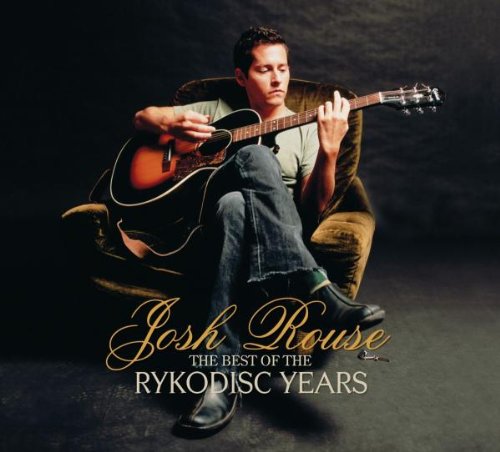 Man sitting in armchair playing guitar, album cover with title text below.