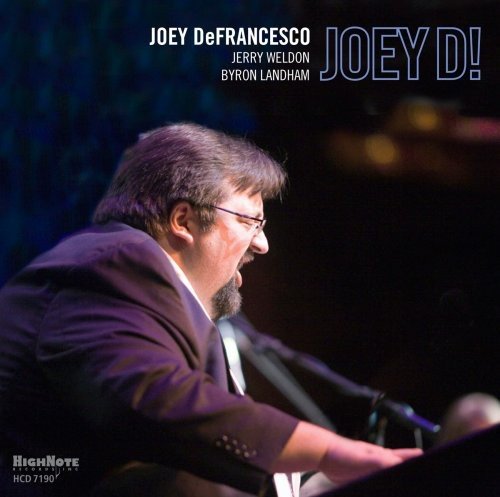 "Album cover featuring a man playing an organ, with text 'JOEY D!' and artist names."