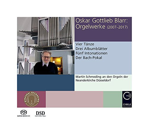 "CD cover with a man standing in front of a large organ."