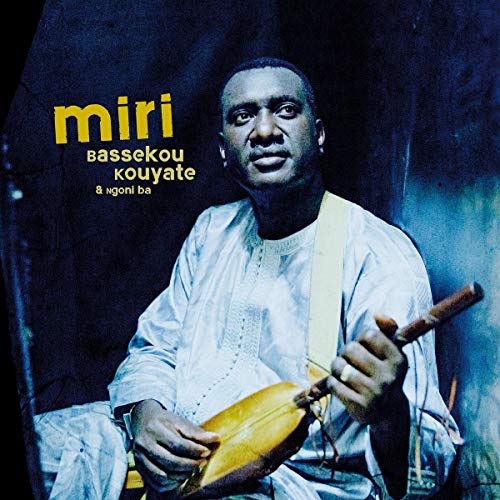 "Album cover featuring a man playing a stringed instrument, wearing white, against a dark background."