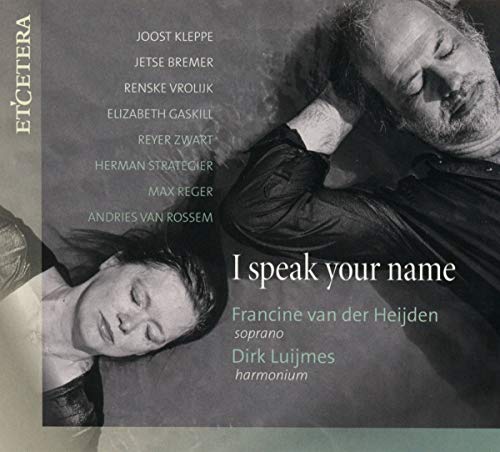 The image depicts a CD cover for "I Speak Your Name" by Francine van der Heijden, featuring a black-and-white photograph of two individuals. * The cover includes the following elements: + A man and woman lying on their backs, heads tilted towards each other + The title "I speak your name" in white text + The artist's name "Francine van der Heijden soprano" and "Dirk Luijmes harmonium" in smaller white