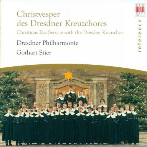 "CD cover featuring a choir in robes with Christmas trees and ornate background."