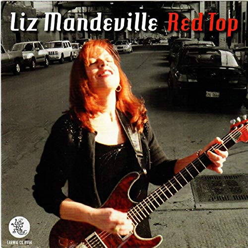 CD cover: Liz Mandeville with red hair playing guitar on a street.