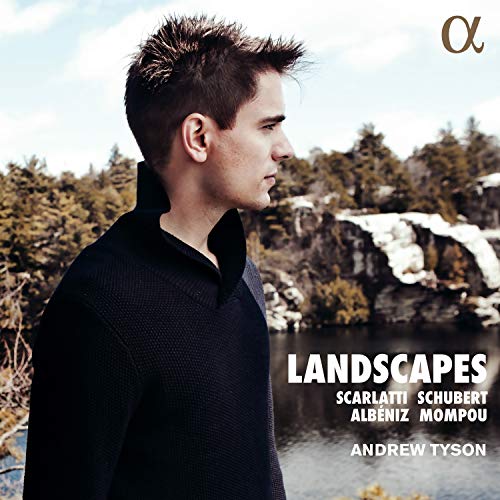 "Album cover featuring a man in a black shirt with a snowy landscape background."