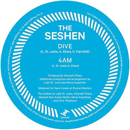 Blue vinyl record label with white text and sunburst design on a white background.