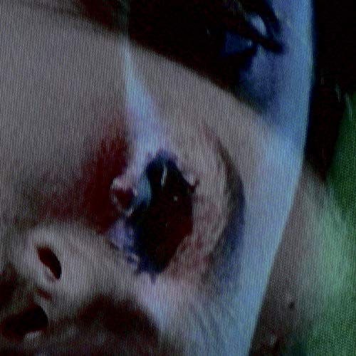 The image appears to be a close-up of a person's eye. A concise, descriptive alt text for this image could be: "A close-up of a person's eye with dark eye makeup."