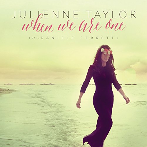"CD cover featuring a woman walking on a beach, wearing a black dress."