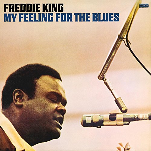 Vinyl album cover featuring Freddie King singing into a microphone.