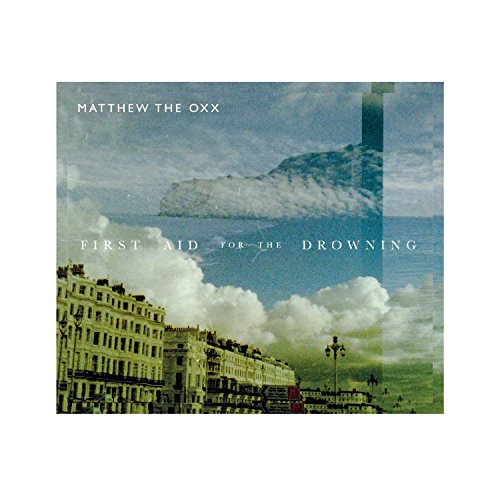 "Album cover with a distorted, layered image of a seaside town."