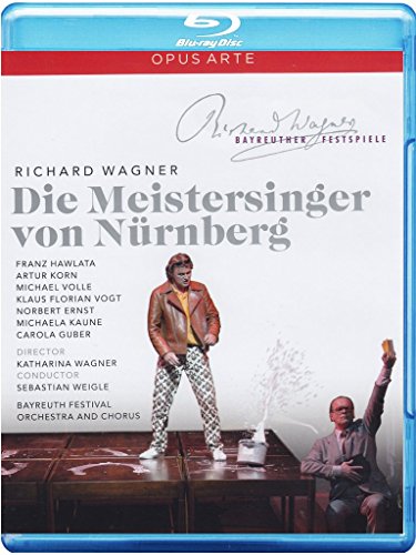 "Blu-ray cover with two men on stage, one standing, one kneeling, against a white background."
