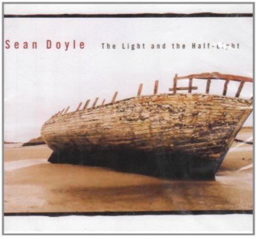 "Album cover with a weathered boat on a sandy beach, titled Sean Doyle."
