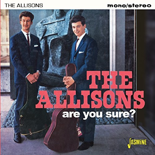 Album cover featuring two men in suits with guitar cases, bold red and white text.