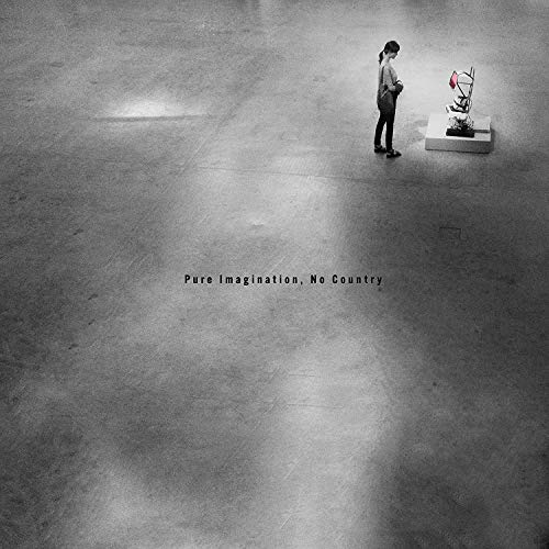 Black and white album cover with a person standing near a sculpture on a pedestal.