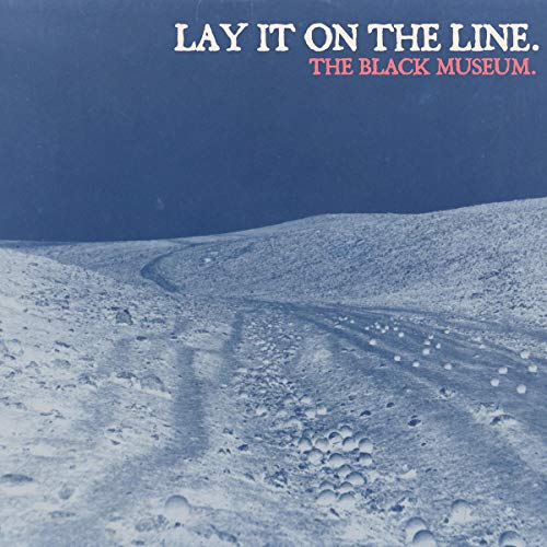 The image is a CD cover featuring a snowy landscape with tire tracks. Alt text: Snowy road with tire tracks and "Lay It On The Line: The Black Museum" text.