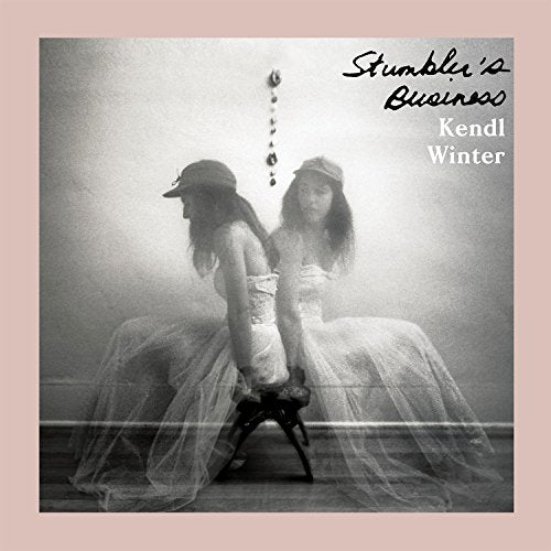 Black and white vinyl album cover with two women in dresses and hats.