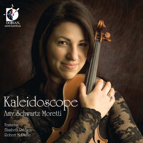 Woman holding a violin, wearing a black lace top, on a dark brown background.