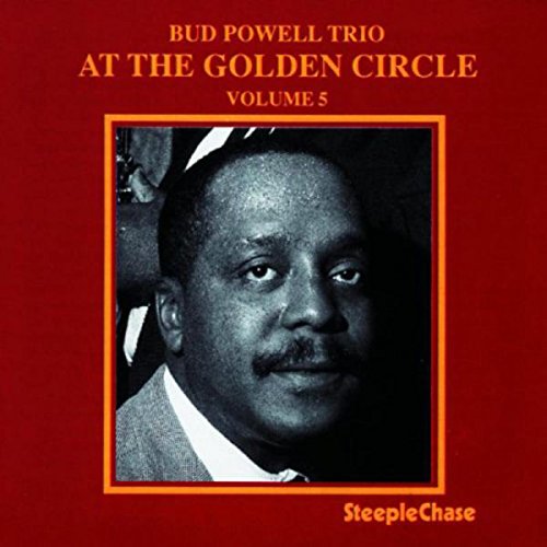 Red album cover with a black-and-white portrait of a man in an orange frame.